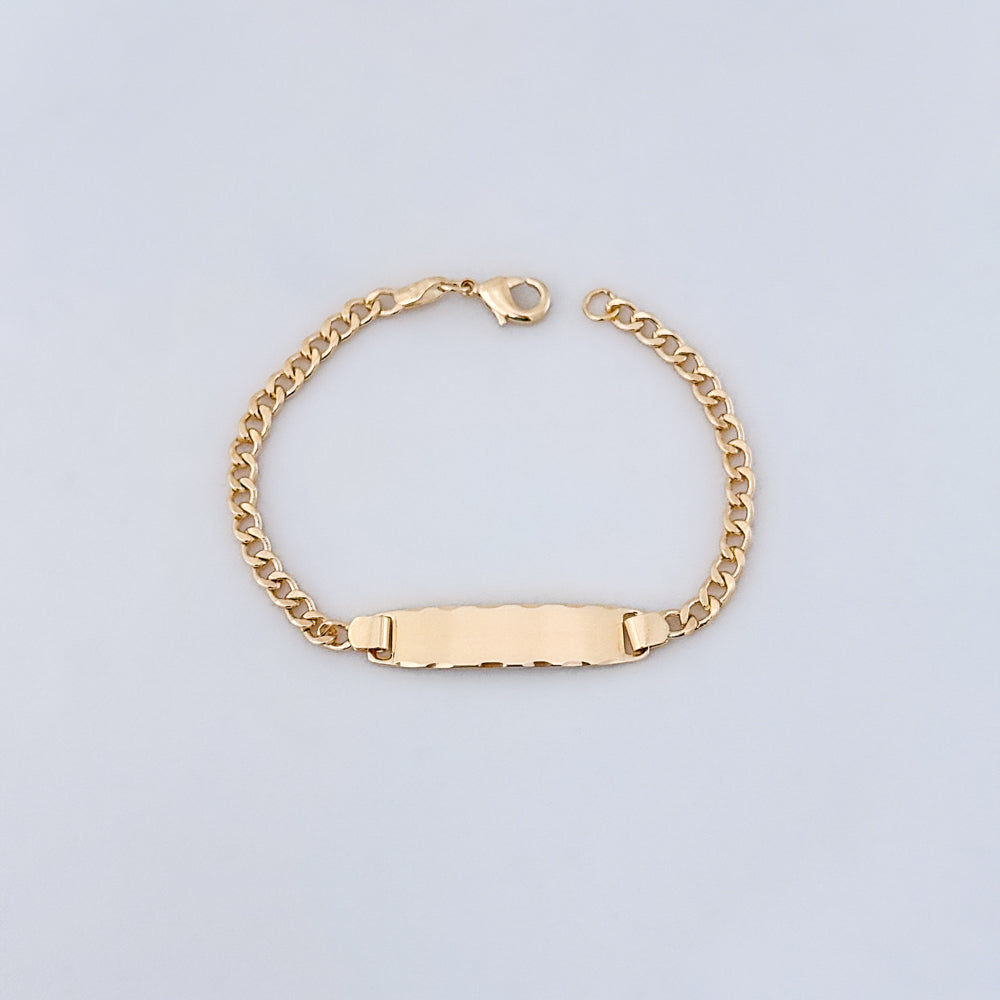 A gold-filled curb chain ID bracelet with an engraving plate, displayed on a white background.