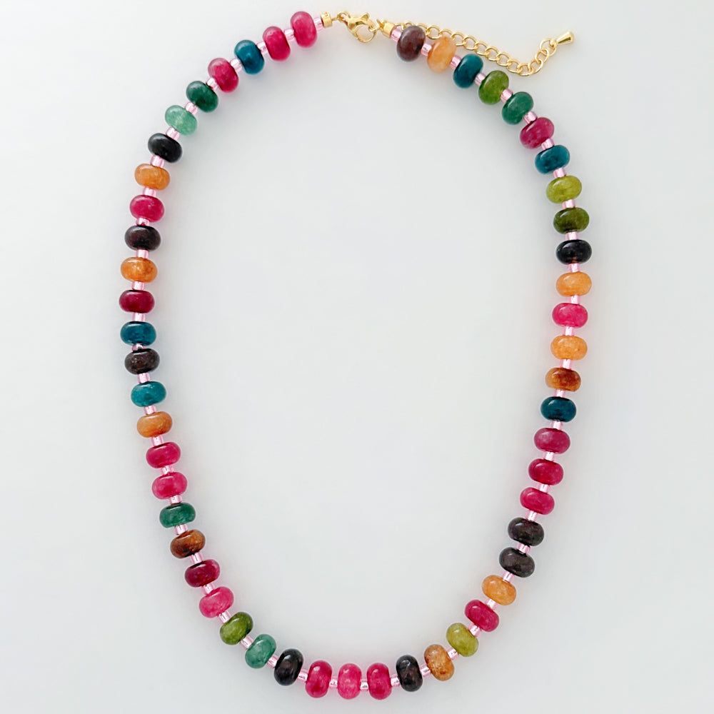 Colorful beaded necklace on a white background