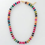 Colorful beaded necklace on a white background