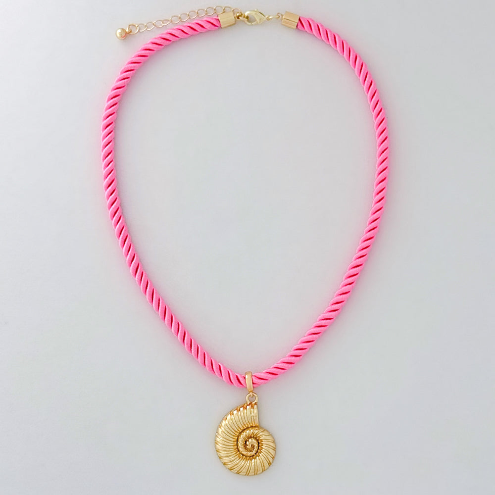 Neon pink necklace with a gold shell pendant on a light gray background