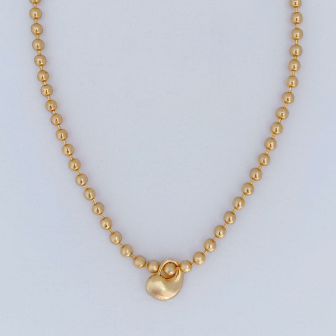 Dulce Necklace featuring chunky triple gold plated ball chain and a heart pendant in a polished waterproof finish