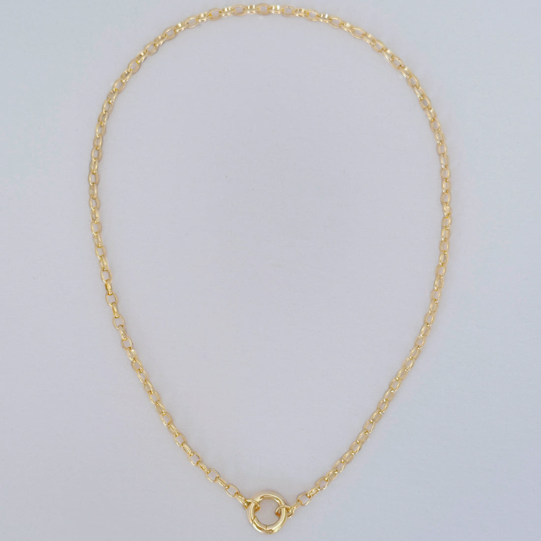 Full view of charm-ready gold necklace with triple gold plated oval chain links