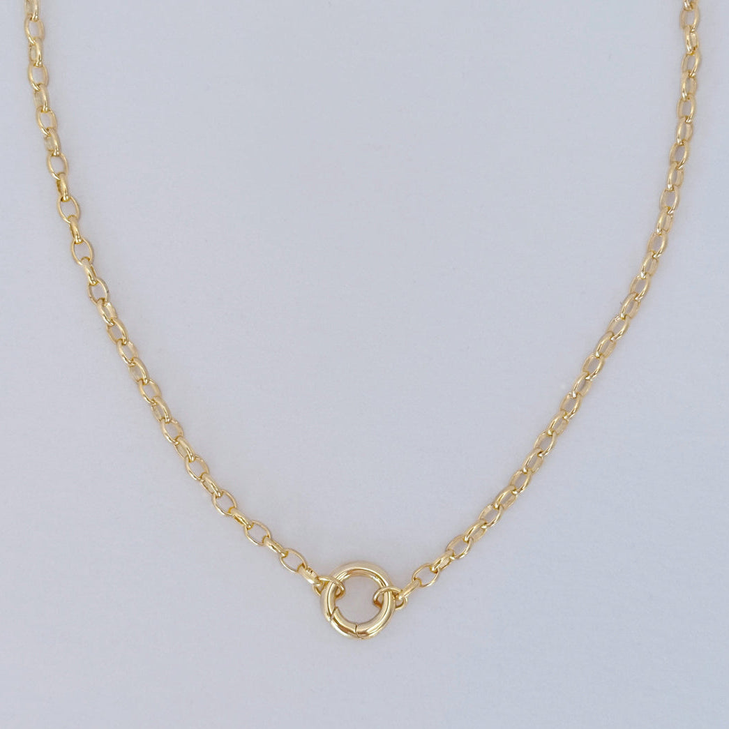 Chana necklace with 17-inch oval link chain and gold round clasp, designed for charms
