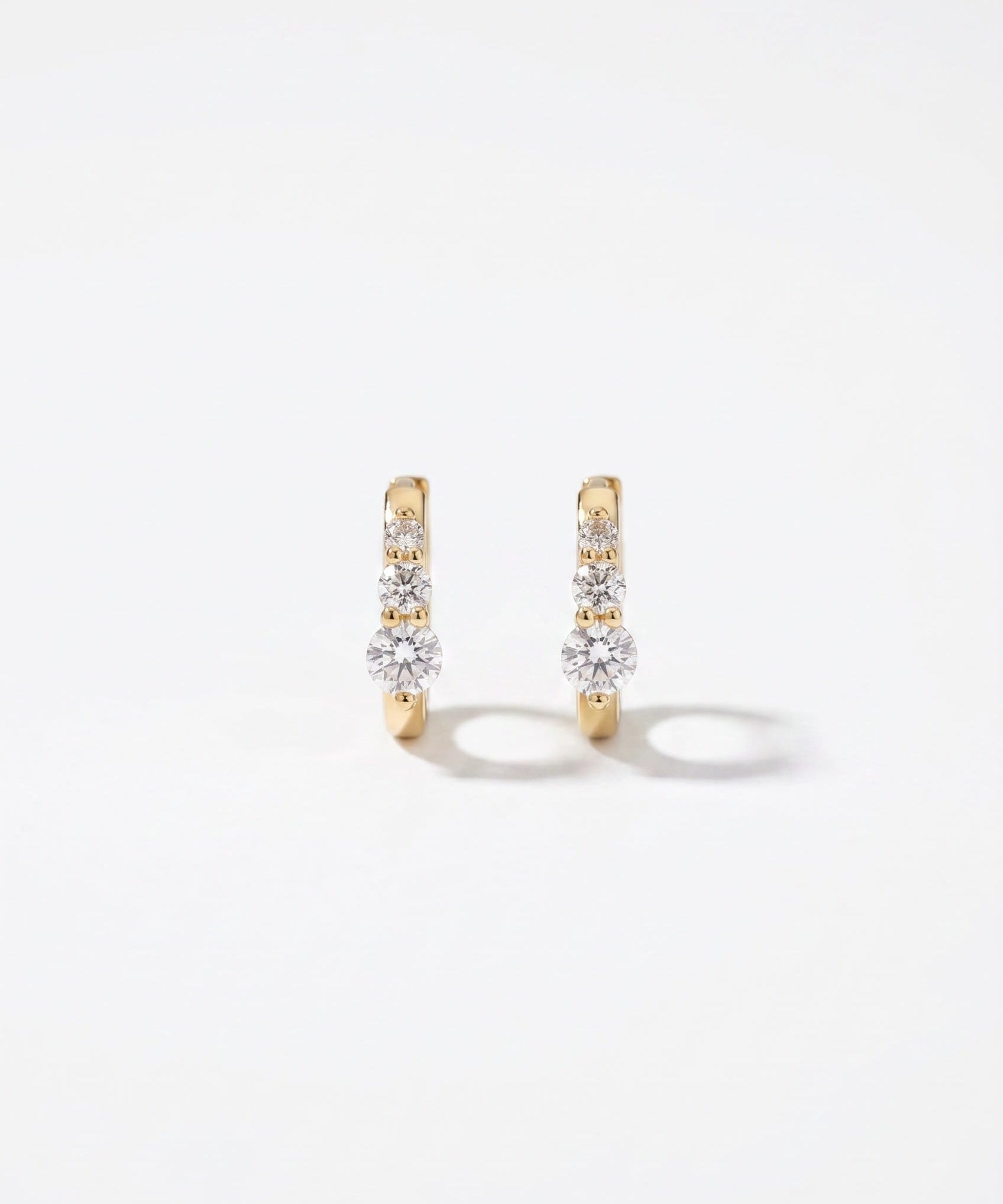 LE sensor earrings Lumen Graduated CZ Huggie Earrings