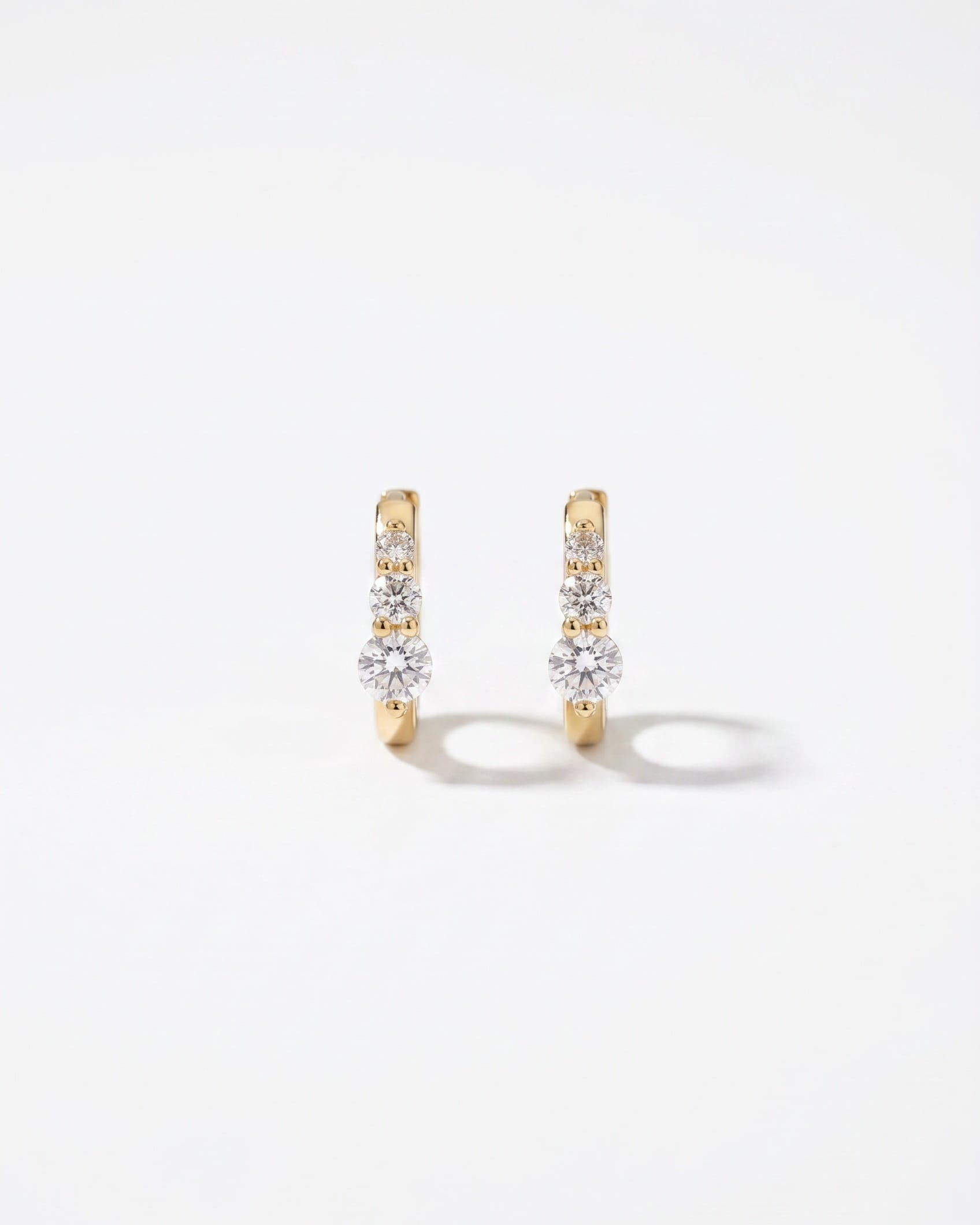 LE sensor earrings Lumen Graduated CZ Huggie Earrings