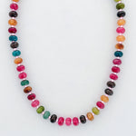 Necklace with multicolored beads on a white background