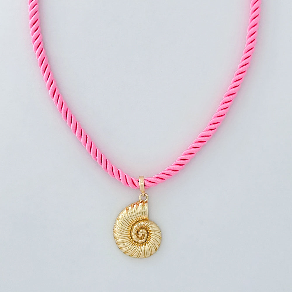 Necklace with a pink cord and gold shell pendant on a light gray background