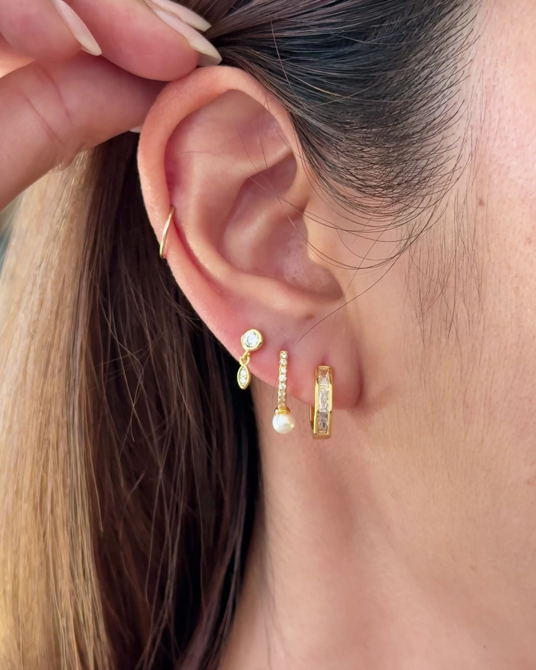 video showing vesper baguette huggies with other earring stacks