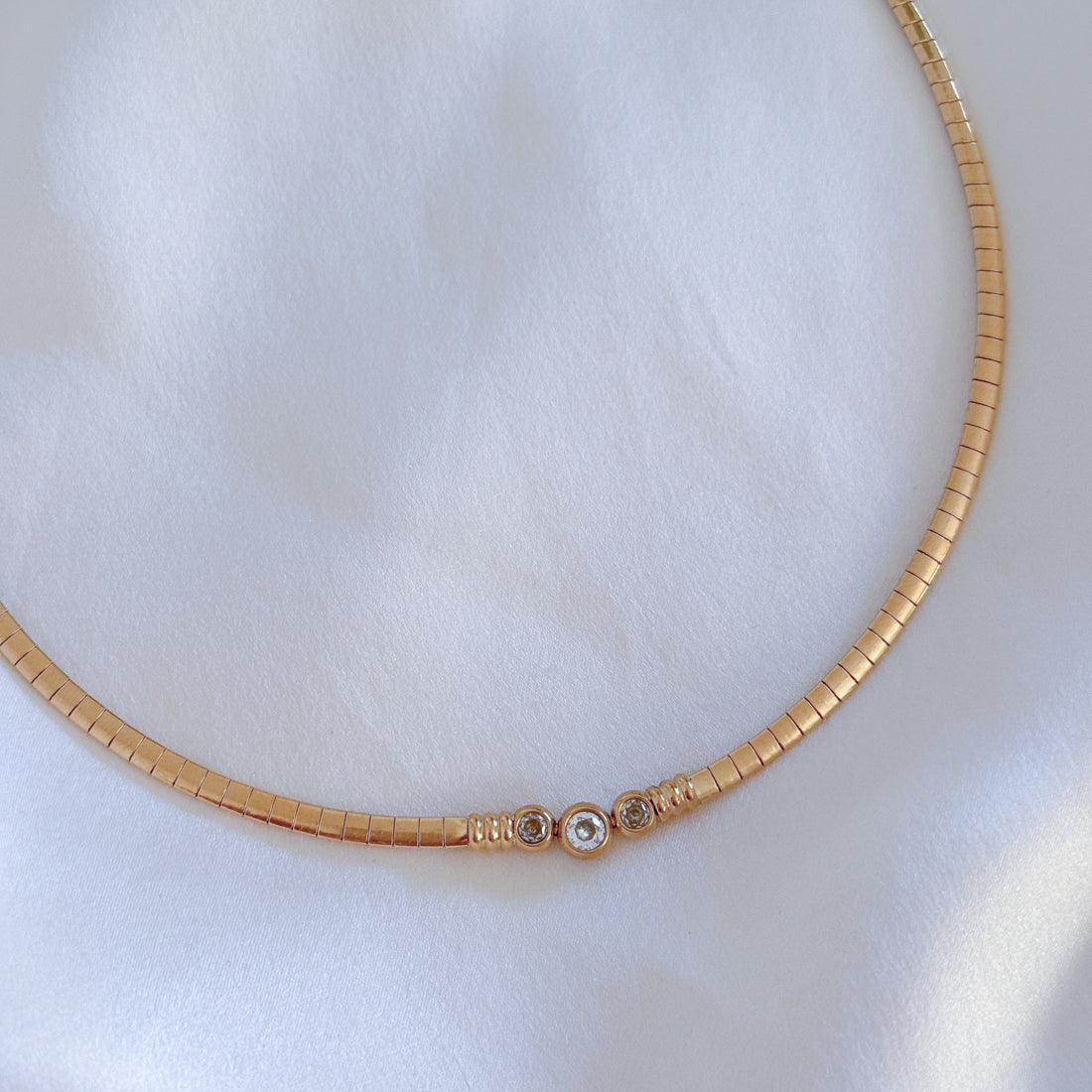 18K gold plated collar necklace flat snake  chain and CZ center accents on white background. Waterproof hypoallergenic non tarnish jewelry by LE Sensor.