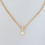 gold necklace with pear-shaped pendant on 14k gold-filled box chain, close-up detail